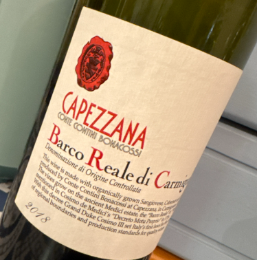 a bottle of Capezzana Barco Di Reale Carmignano 2018