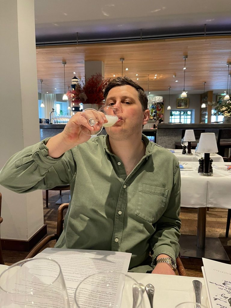 James of Through the Terroir Drinking a Glass of Champagne